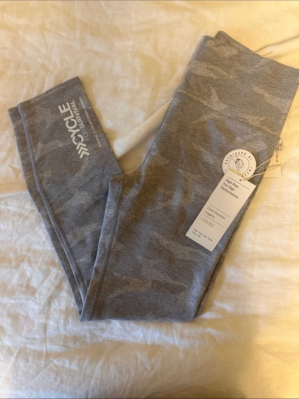 Vuori Clean Elevation Leggings - pale heather camo x cycle for survival logo